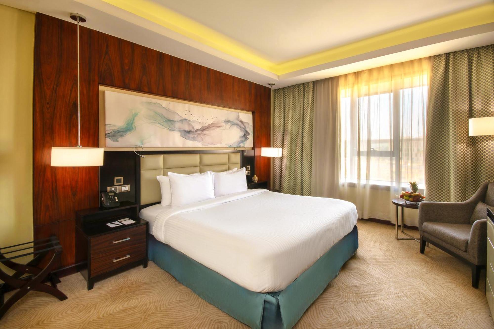 Triumph Luxury Hotel Il Il Cairo Camera foto A bedroom at the hotel